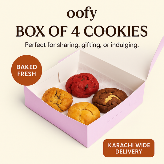 Box of four cookies with a pink box on a beige background, featuring text about delivery and freshness.